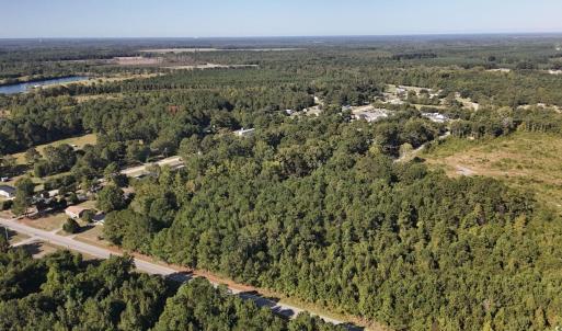 View of property location with a forest