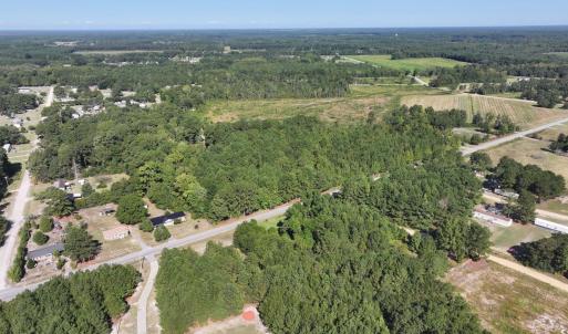 View of property location featuring a forest and r