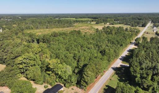 Aerial view of property and surrounding area with