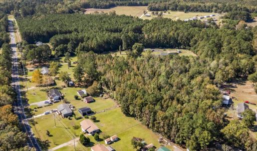 Aerial view of property and surrounding area with