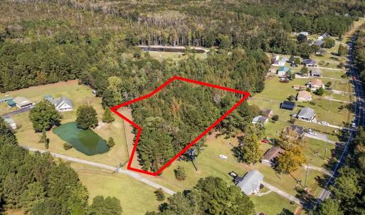 Aerial view of property and surrounding area with