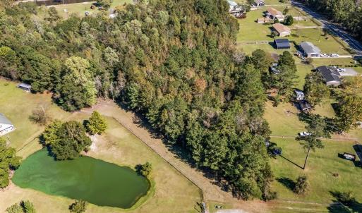 Aerial view of property's location with a large bo