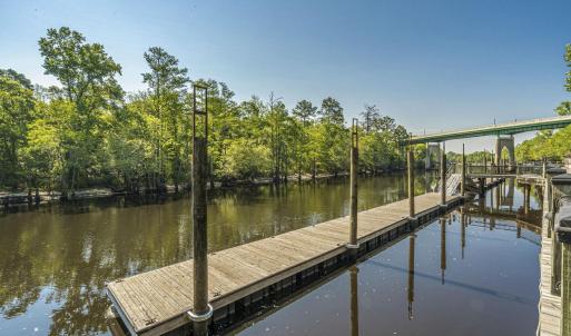 Dock area featuring a water view