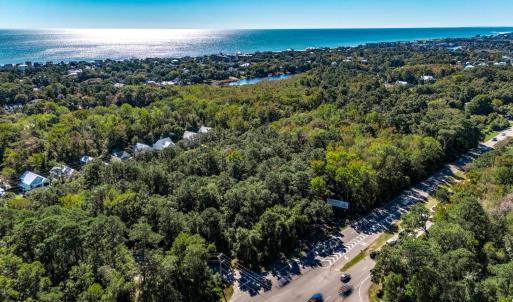 Bird's eye view of a heavily wooded area and a lar