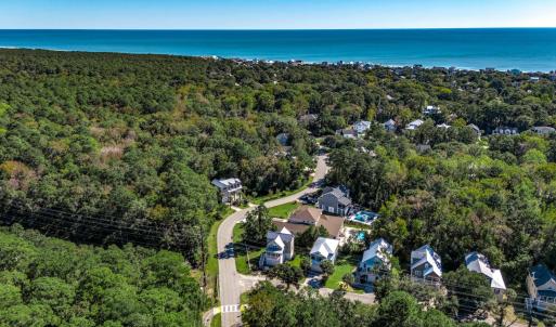 View of property location with a forest and a near