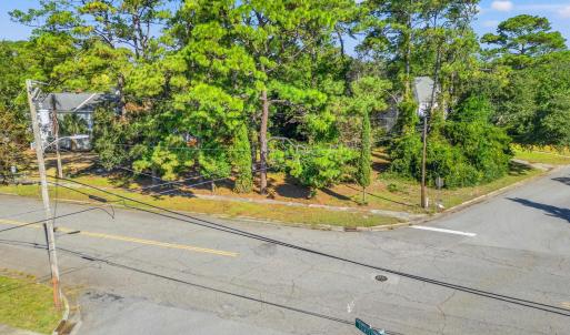 View of asphalt street with curbs and street light