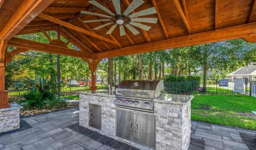 View of patio with area for grilling, a gazebo, a