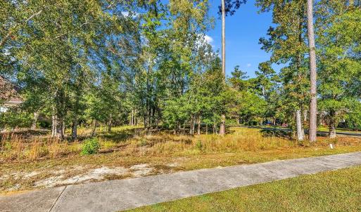 View of yard featuring view of wooded area