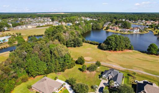 Aerial view of residential area with a nearby body
