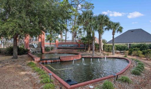 View of community with a garden pond