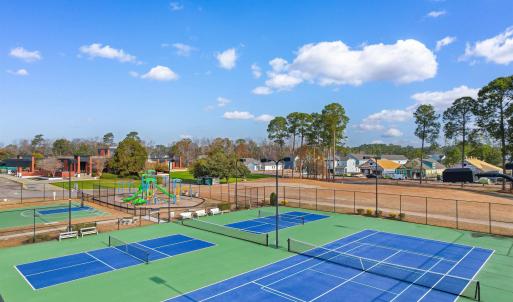 View of tennis court featuring community basketbal