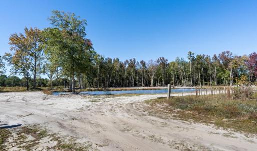 View of dirt / gravel road featuring a water view
