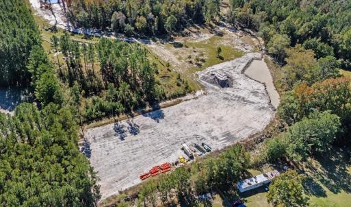 View of property location with a heavily wooded ar