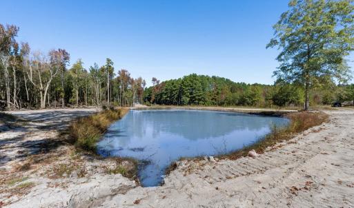 Water view featuring a heavily wooded area