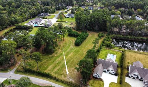 Aerial view of property and surrounding area with