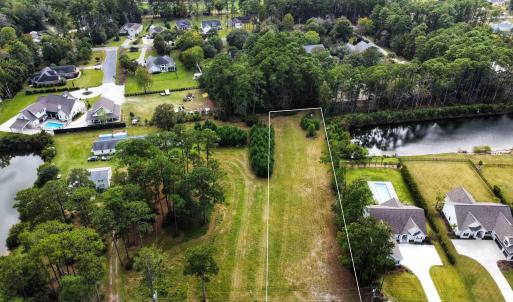 Aerial view of residential area with a large body