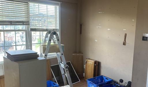 Misc room with a textured ceiling and wood finishe