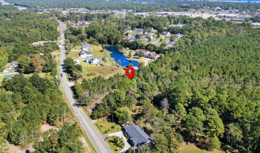 Aerial view of property and surrounding area with