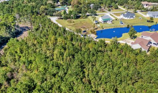 Aerial view of property and surrounding area featu