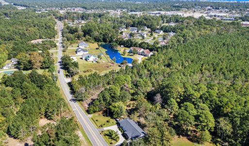 Aerial view of property and surrounding area featu