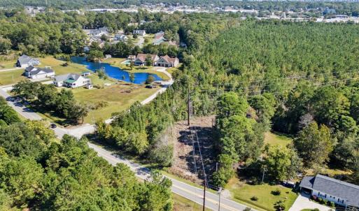 Aerial perspective of suburban area with a nearby