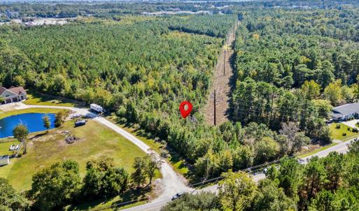 Aerial view of property and surrounding area with