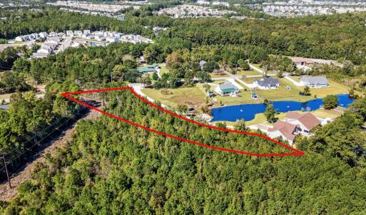 Aerial view of property and surrounding area with