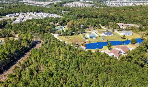 Aerial view of property and surrounding area featu