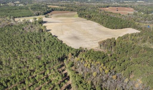 Aerial view of property and surrounding area with