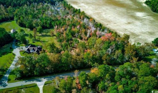 Aerial view of property and surrounding area with