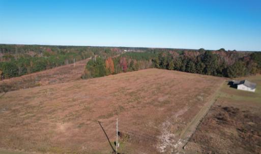 Aerial view of property and surrounding area with