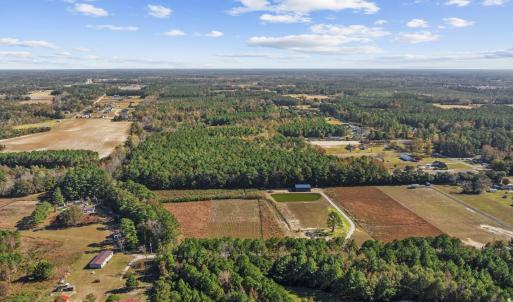 View of property location featuring a forest