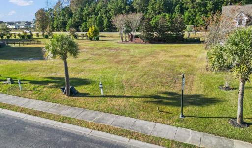 View of home's community featuring a lawn