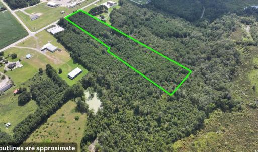 Aerial view of property's location with a forest a