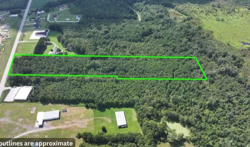 Aerial view of property and surrounding area with