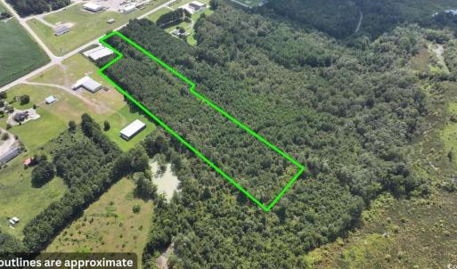 Aerial view of property's location with a forest a