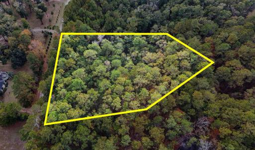 Aerial view of property and surrounding area with