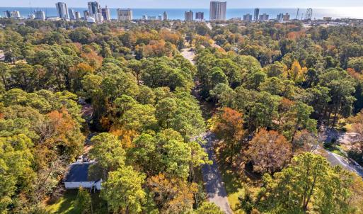 Aerial view of property's location with city skyli