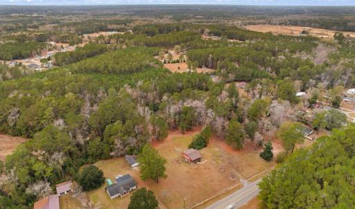 Aerial view of property and surrounding area with