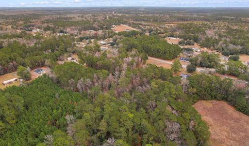 Aerial view of property and surrounding area with