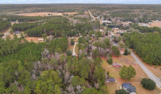 Aerial view of property and surrounding area with