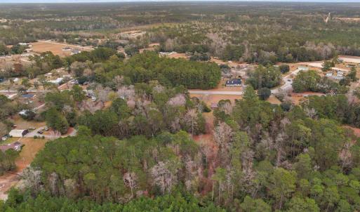 Aerial view of property and surrounding area with