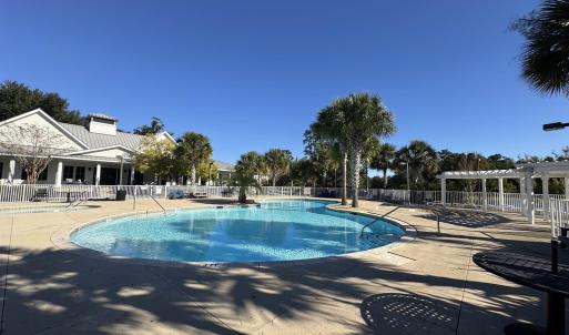 Community pool with a patio and a pergola