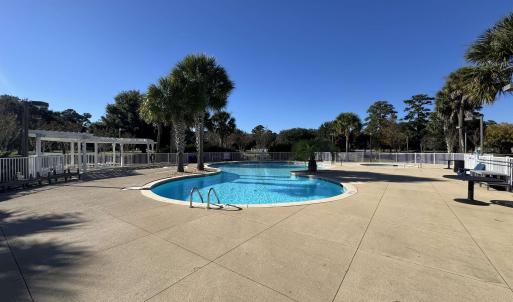 Community pool with a patio area