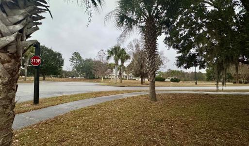 View of asphalt street with sidewalks and traffic