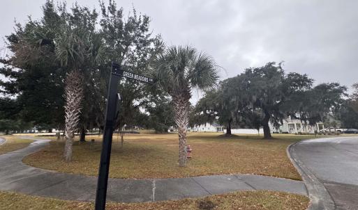 View of home's community featuring a yard