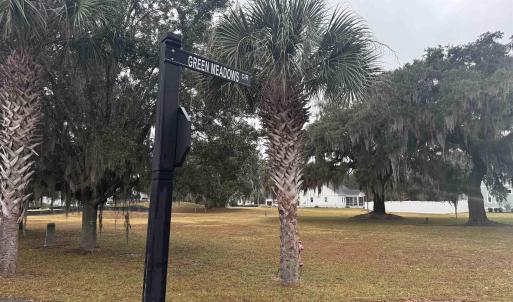 View of community featuring a lawn