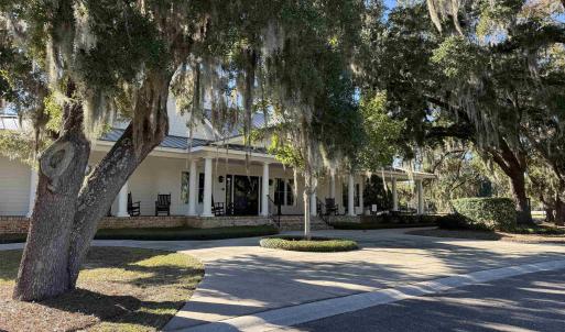 View of front facade featuring a large porch, a me