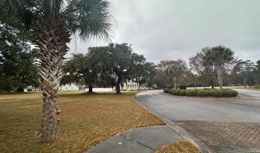 View of asphalt road featuring curbs