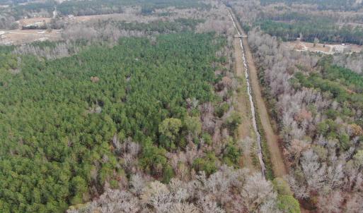 Aerial view of property and surrounding area with
